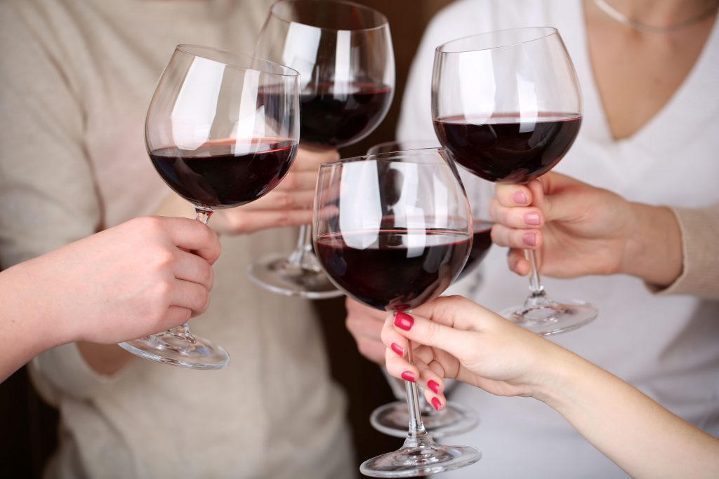 35885506 - woman hands with glasses of wine close-up